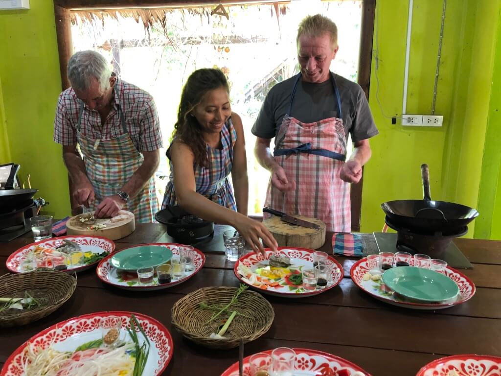 Three people cooking Thai food