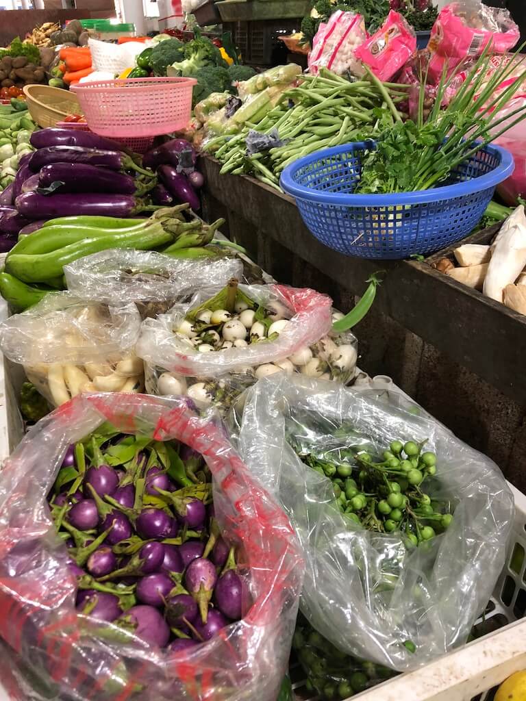 Different coloured vegetables at a local market.