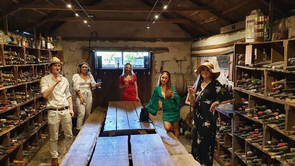 Guests_stood_in_a_cellar_enjoying_a_private_wine_tasting_whilst_on_a_Coonawarra_Experiences_tour_a_great_thing_to_do_in_Coonawarra