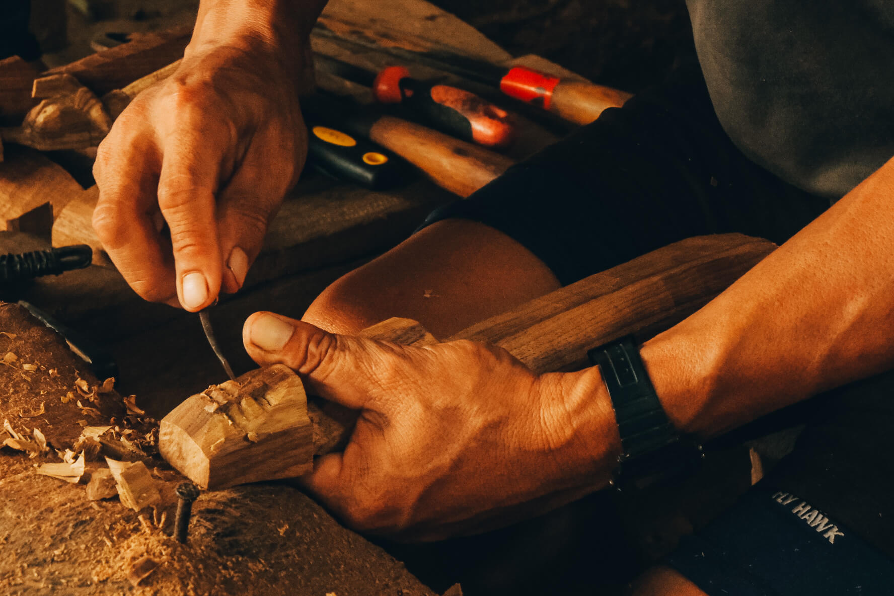 A_picture_of_hands_carving_wood